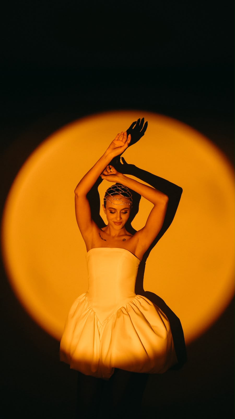Bride dancing in a circle of orange light
