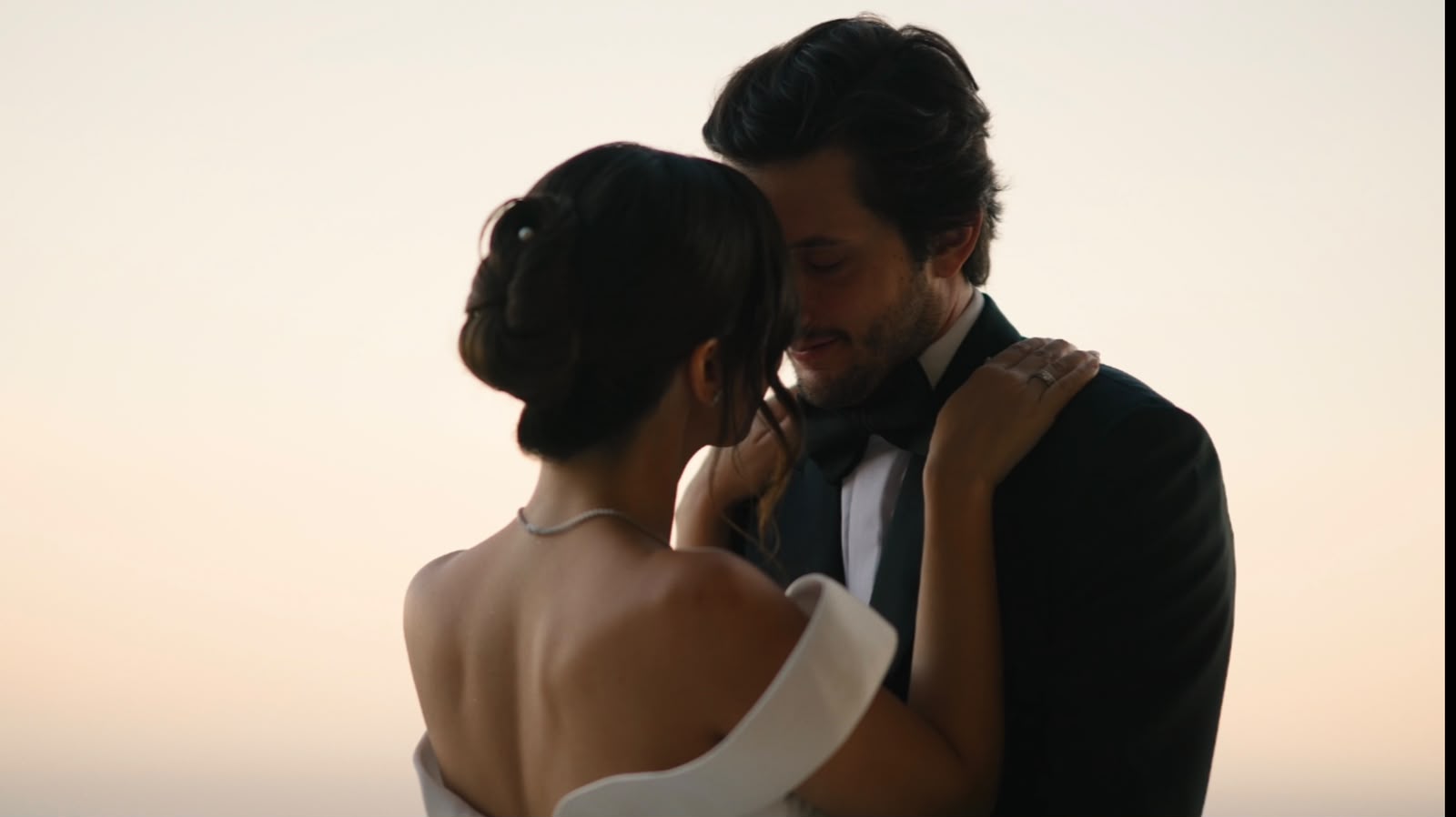 Couple embracing at sunset