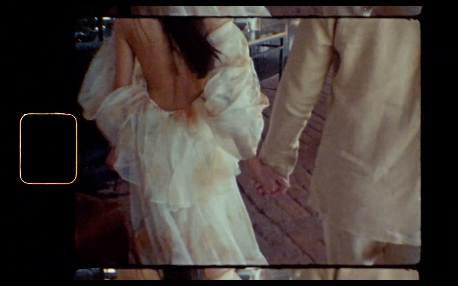 Couple holding hands, Super 8 frame